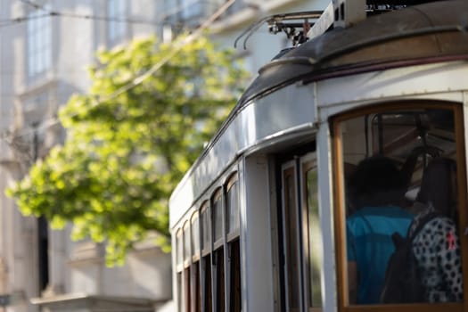 An old tram in the centre of Lisbon. Mid shot