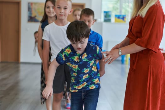 Preschool children wait in line for new and interesting games. Selective focus.