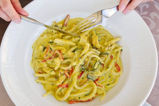 Tasty Pasta with sauce in white bowl. Flat lay. Top view. Eating in restaurant. Italian food