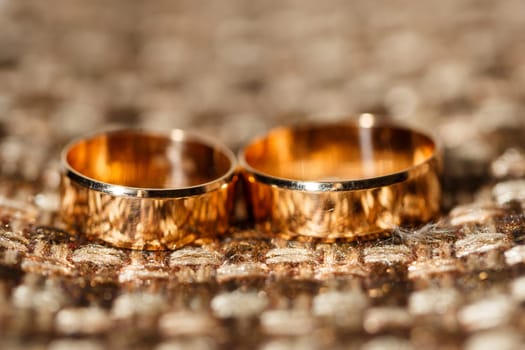 Golden wedding rings for newlyweds on their wedding day