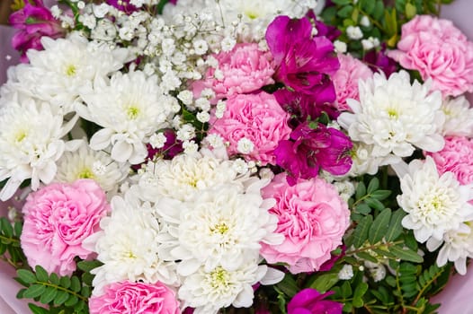 Mixed colorful flowers background. Vibrant colors of mixed flowers backdrop. gerbera, tulips and mix of summer flowers bouquet