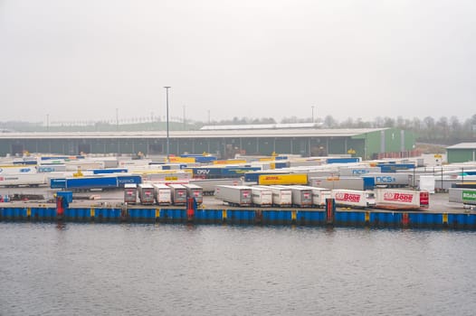 Travemunde, Germany - April 2023. Cargo Sea port Logistics and transportation of Container and cargo car trailers. German Import and Export at baltic sea.
