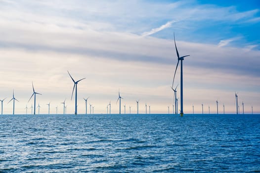 Offshore Windmill farm. windmills isolated at sea on a beautiful bright day Netherlands. green energy Flevoland global warming renewable enrgy with windmills