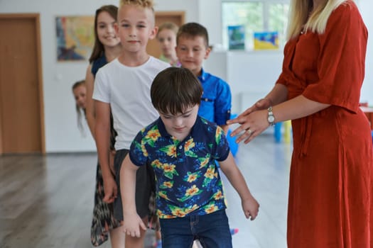 Preschool children wait in line for new and interesting games. Selective focus.