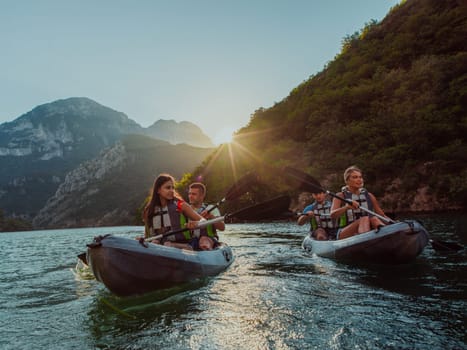 A group of friends enjoying fun and kayaking exploring the calm river, surrounding forest and large natural river canyons during an idyllic sunset