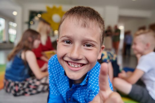 Portrait photo of a smiling boy in a preschool institution having fun. High quality photo