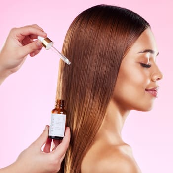 Woman, studio profile and hair care oil for shine, health and treatment for beauty, strong and wellness of scalp. Happy gen z model, serum and liquid formula for cosmetics, healthy locks and smile.