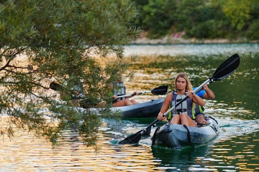 A group of friends enjoying having fun and kayaking while exploring the calm river, surrounding forest and large natural river canyons.