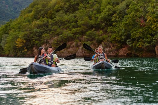 A group of friends enjoying having fun and kayaking while exploring the calm river, surrounding forest and large natural river canyons.