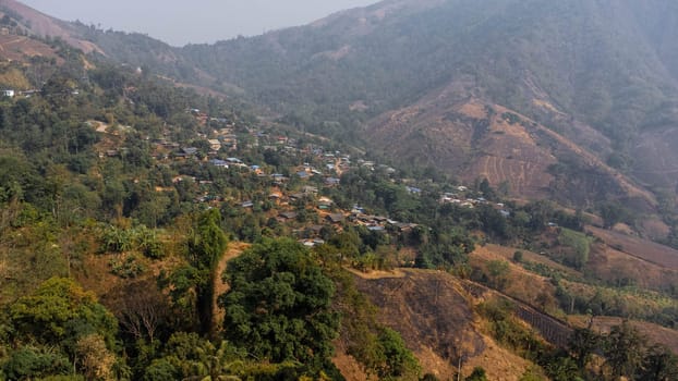 A view from a drone of a rural mountain village in northern Thailand. village on the plateau