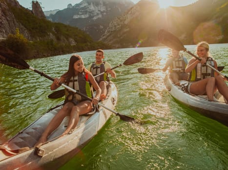 A group of friends enjoying fun and kayaking exploring the calm river, surrounding forest and large natural river canyons during an idyllic sunset