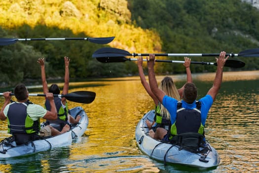 A group of friends enjoying having fun and kayaking while exploring the calm river, surrounding forest and large natural river canyons.