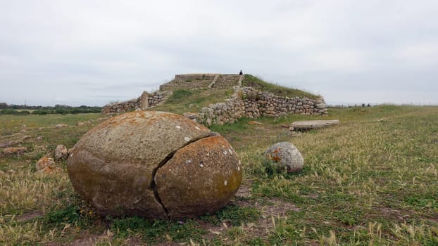 Sassari, Sardinia in Italy, May 18 2023. Some sacred stones in front of the sacred altar of Monte D'Accoddi. Dating back to 4000 BC.