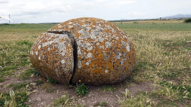 Sassari, Sardinia in Italy, May 18 2023. One of the sacred stones of the altar of Monte D'Accoddi. Dating back to 4000 BC.