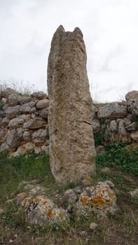 Sassari, Sardinia in Italy, May 18 2023. A menhir in front of the sacred altar of Monte d'Accoddi. Dating back to 4000 BC.