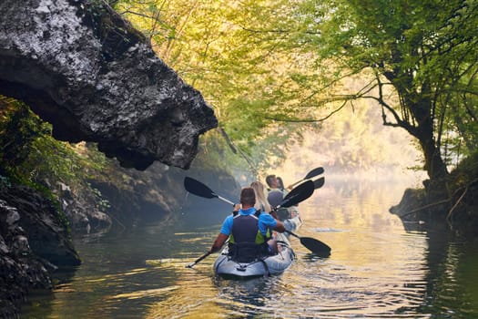 A group of friends enjoying having fun and kayaking while exploring the calm river, surrounding forest and large natural river canyons.