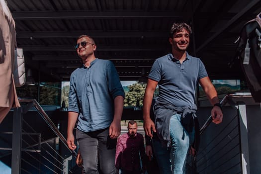 A diverse group of businessmen and colleagues walking together by their workplace, showcasing collaboration and teamwork in the company