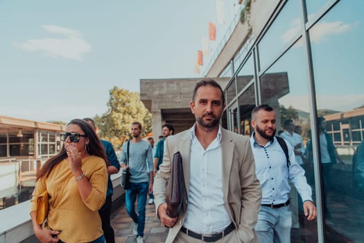 A diverse group of businessmen and colleagues walking together by their workplace, showcasing collaboration and teamwork in the company