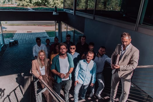 A diverse group of businessmen and colleagues walking together by their workplace, showcasing collaboration and teamwork in the company