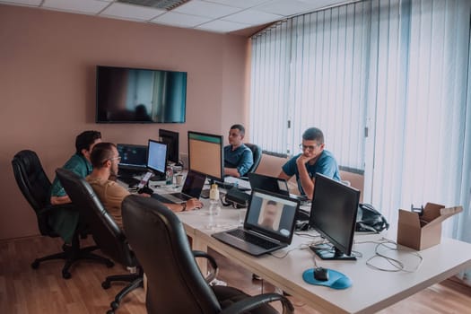 Programmers engrossed in deep collaboration, diligently working together to solve complex problems and develop innovative mobile applications with seamless functionality