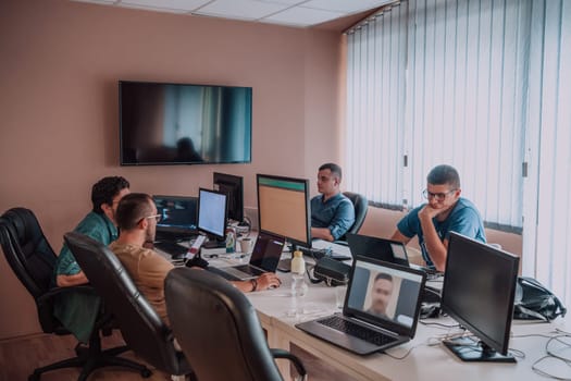 Programmers engrossed in deep collaboration, diligently working together to solve complex problems and develop innovative mobile applications with seamless functionality