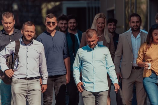 A diverse group of businessmen and colleagues walking together by their workplace, showcasing collaboration and teamwork in the company