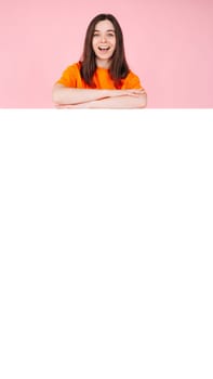 Young Woman in Shock and Excitement with Folded Arms, Standing in Front of a Large Empty Space Banner for Affordable Brand Offers. Perfect for Promotions, Sales, and Advertising Campaigns
