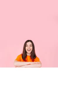 Young Woman in Shock and Excitement with Folded Arms, Standing in Front of a Large Empty Space Banner for Affordable Brand Offers. Perfect for Promotions, Sales, and Advertising Campaigns