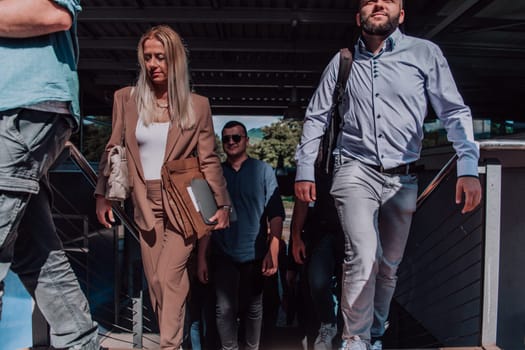 A diverse group of businessmen and colleagues walking together by their workplace, showcasing collaboration and teamwork in the company