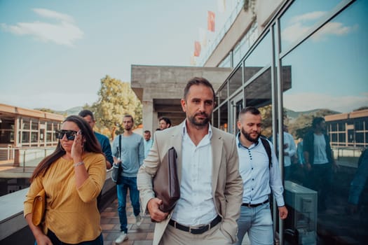 A diverse group of businessmen and colleagues walking together by their workplace, showcasing collaboration and teamwork in the company