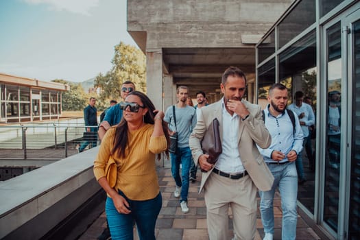 A diverse group of businessmen and colleagues walking together by their workplace, showcasing collaboration and teamwork in the company