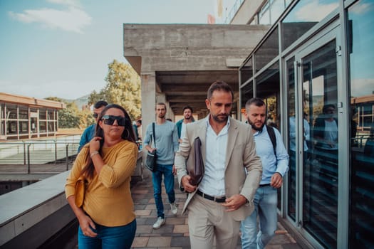 A diverse group of businessmen and colleagues walking together by their workplace, showcasing collaboration and teamwork in the company