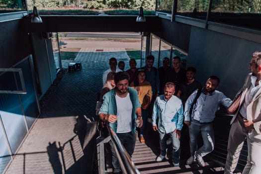 A diverse group of businessmen and colleagues walking together by their workplace, showcasing collaboration and teamwork in the company