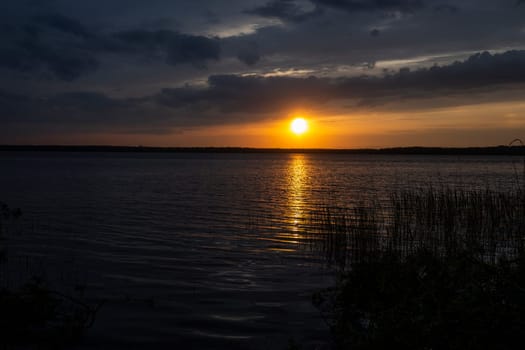 Incredibly beautiful sunset on the lake. High quality photo