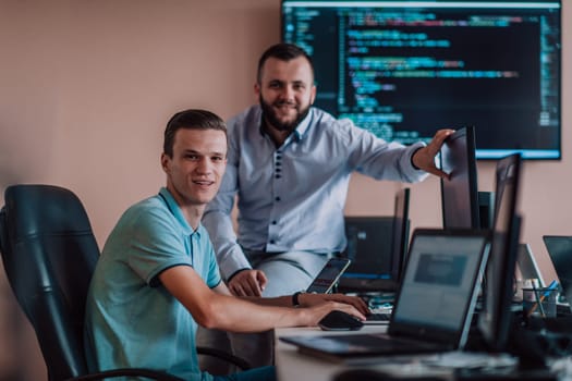 Programmers engrossed in deep collaboration, diligently working together to solve complex problems and develop innovative mobile applications with seamless functionality