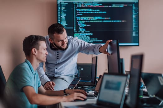 Programmers engrossed in deep collaboration, diligently working together to solve complex problems and develop innovative mobile applications with seamless functionality