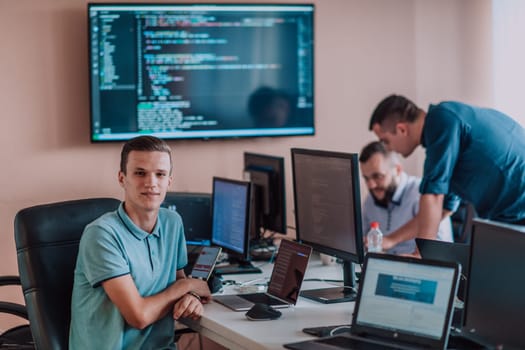 Programmers engrossed in deep collaboration, diligently working together to solve complex problems and develop innovative mobile applications with seamless functionality