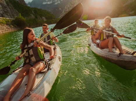 A group of friends enjoying fun and kayaking exploring the calm river, surrounding forest and large natural river canyons during an idyllic sunset