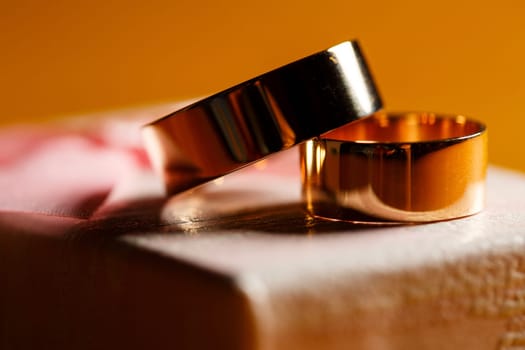 Golden wedding rings for newlyweds on their wedding day