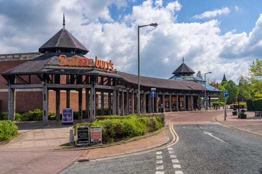 Oswestry, Shropshire - 12 May 2023: Entrance to Sainsburys supermarket on sunny day in England