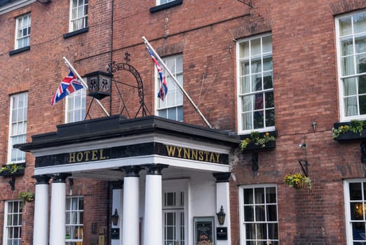 Oswestry, Shropshire - 12 May 2023: Pillars and entrance to refurbished Wynnstay Hotel in market town of Oswestry