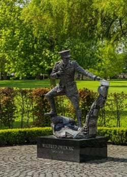 Oswestry, Shropshire - 12 May 2023: Wilfred Owen statue in Cae Glas park in market town of Oswestry