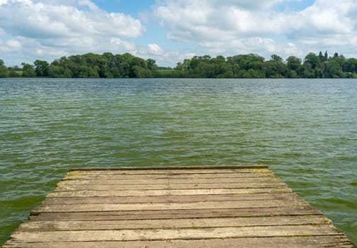 Panorama of the lake shore of the Mere with a wooden pier in Ellesmere in Shropshire