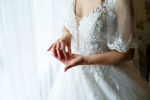 Golden wedding rings for newlyweds on their wedding day