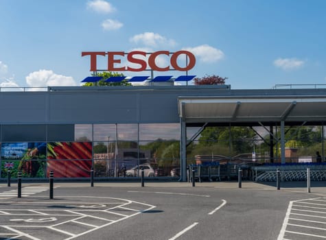 Ellesmere, Shropshire - 12 May 2023: Entrance to Tesco supermarket on sunny day in England