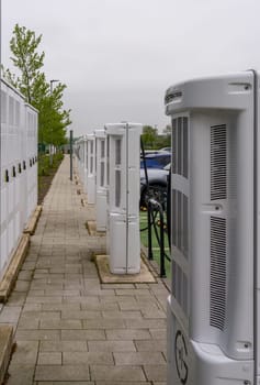 Midlands, UK - 13 May 2023: Rear view of electric car charging points on motorway