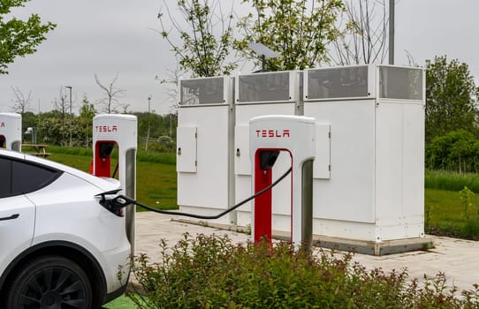 Midlands, UK - 13 May 2023: Tesla electric car charging points on motorway