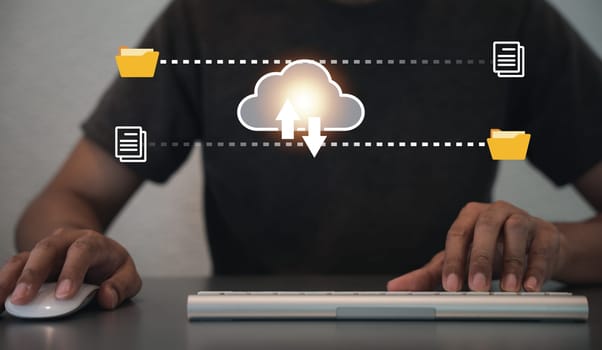 Laptop with cloud computing diagram on display, a man accessing data storage, server, and networking services for financial analysis, a fintech concept for online businesses.