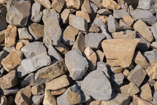 Gravel texture. Pebble stone background. Light grey closeup small rocks. Top view of ground gravel road