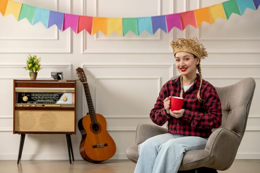 festa junina cute girl in straw hat brazilian midsummer with retro radio guitar holding red cup